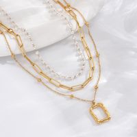 304 Stainless Steel 14K Gold Plated Elegant Simple Style Roman Style Pearl Plating Inlay Triangle Square Roman Numeral Acrylic Three Layer Necklace main image 4