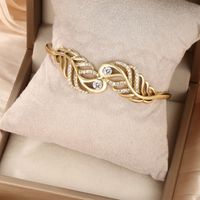 Glam Exaggerated Xuping Geometric Feather Alloy Plating Hollow Out Inlay Artificial Gemstones 14k Gold Plated White Gold Plated Women's Bangle main image 1