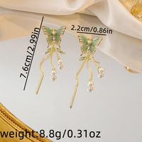 1 Pair Sweet Simple Style Butterfly Tassel Pearl Alloy Drop Earrings main image 3