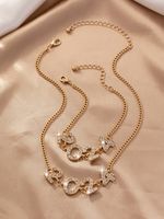 Elegante Lujoso Número Ferroaleaciones Enchapado Embutido Diamantes De Imitación Chapado En Oro Mujeres Pulsera Collar sku image 1