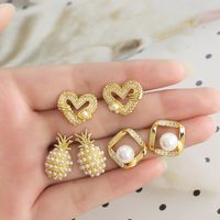 1 Pair Modern Style Simple Style Square Heart Shape Pineapple Plating Inlay Copper Artificial Pearls Zircon 18k Gold Plated Ear Studs main image 1