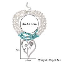 Simple Style Commute Heart Shape Imitation Pearl Alloy Turquoise Knitting Women's Three Layer Necklace main image 2