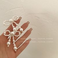1 Paar Mode Bogenknoten Legierung Glas Perlen Überzug Frau Ohrclips Ohrringe sku image 1