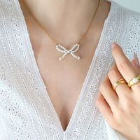 Simple Style Bow Knot Titanium Steel Pearl Plating Pendant Necklace 1 Piece main image 1