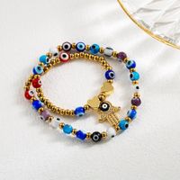 Cool Style Cross Devil's Eye Snake Stainless Steel Artificial Pearl Imitation Pearl Enamel Plating Inlay Artificial Gemstones Gold Plated Bracelets main image 5