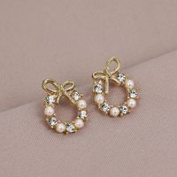 1 Pair Simple Style Circle Bow Knot Alloy Hollow Out Inlay Rhinestones Pearl Women's Ear Studs main image 2