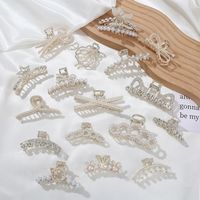 Elegant Star Bow Knot Shell Alloy Plating Hollow Out Inlay Rhinestones Pearl Hair Claws main image 1