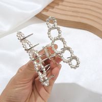 Elegant Star Bow Knot Shell Alloy Plating Hollow Out Inlay Rhinestones Pearl Hair Claws main image 5