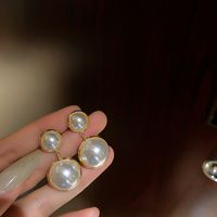 Elegante Oval Forma De Corazón Rosa Aleación Embutido Perlas Artificiales Diamantes De Imitación Mujeres Aretes sku image 2