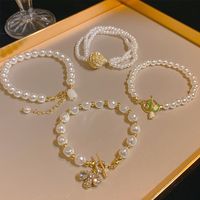 Sucré Fleur Noeud D'arc Perle D'imitation Femmes Bracelets main image 1