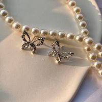 1 Pair Fashion Butterfly Alloy Plating Hollow Out Inlay Rhinestones Silver Plated Women's Ear Studs main image 1