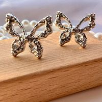 1 Pair Fashion Butterfly Alloy Plating Hollow Out Inlay Rhinestones Silver Plated Women's Ear Studs main image 2