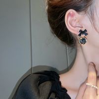 1 Pair Lady Bow Knot Metal Inlay Artificial Gemstones Women's Drop Earrings main image 5