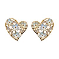 Wholesale Jewelry 1 Pair Simple Style Heart Shape Solid Color Twist Metal Zircon Earrings Ear Studs main image 5