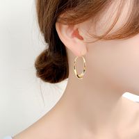 Wholesale Jewelry 1 Pair Simple Style Heart Shape Solid Color Twist Metal Zircon Earrings Ear Studs main image 4