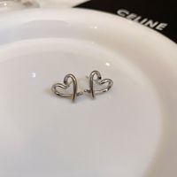 Wholesale Jewelry 1 Pair Simple Style Heart Shape Solid Color Twist Metal Zircon Earrings Ear Studs sku image 12