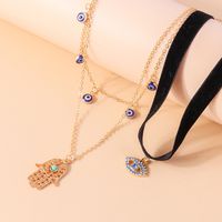 Ethnic Style Modern Style Devil's Eye Palm Fabric Zinc Alloy Plating Hollow Out Inlay Turquoise Rhinestones Women's Layered Necklaces main image 6