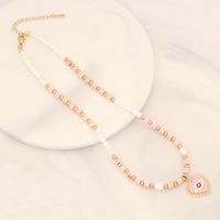 Vacation Bohemian Devil'S Eye Heart Shape Artificial Pearl Natural Stone Copper 18K Gold Plated Zircon Pendant Necklace In Bulk main image 3