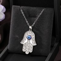 Casual Cool Style Devil's Eye Palm Heart Shape Alloy Hollow Out Inlay Rhinestones Women's Pendant Necklace main image 5
