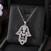 Casual Cool Style Devil's Eye Palm Heart Shape Alloy Hollow Out Inlay Rhinestones Women's Pendant Necklace main image 4