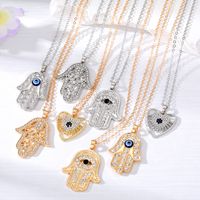 Casual Cool Style Devil's Eye Palm Heart Shape Alloy Hollow Out Inlay Rhinestones Women's Pendant Necklace main image 1