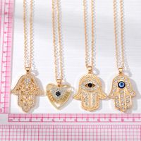 Casual Cool Style Devil's Eye Palm Heart Shape Alloy Hollow Out Inlay Rhinestones Women's Pendant Necklace main image 6