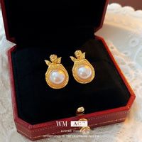 Elegante Oval Forma De Corazón Rosa Aleación Embutido Perlas Artificiales Diamantes De Imitación Mujeres Aretes sku image 24