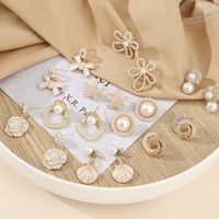Elegant Starfish Flower Bow Knot Alloy Plating Inlay Artificial Pearls Rhinestones Gold Plated Women's Earrings main image 1