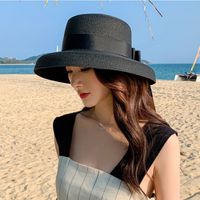 Women's Classic Style Bow Knot Braid Curved Eaves Straw Hat sku image 1