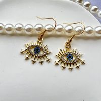 Style Vintage Brillant L'oeil Du Diable Alliage Placage Incruster Zircon Plaqué Or Femmes Boucles D'oreilles main image 2