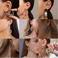 1 Pair Casual Vintage Style Human Face Leaf Heart Shape Plating Hollow Out Inlay Alloy Metal Brass Resin Zircon 18k Gold Plated Gold Plated Silver Plated Earrings main image 1