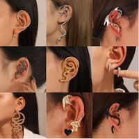 Hip Hop Punk Vêtement De Rue Forme De Cœur Serpent Dragon Alliage Métal Le Cuivre Placage Plaqué Or 18k Plaqué Or Plaqué Argent Femmes Clips D'oreille main image 1