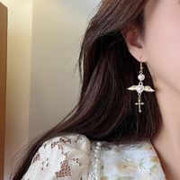 Ethnic Style Wings Alloy Plating Inlay Artificial Pearls Women's Drop Earrings Ear Clips main image 4