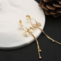 1 Paire Style Ig Style Simple Style Classique Noeud D'arc Placage Incruster Perle D'eau Douce Le Cuivre Zircon Plaqué Or 18k Boucles D'oreilles main image 1