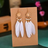 Ethnic Style Flower Feather Metal Hollow Out Inlay Artificial Pearls Rhinestones Women's Drop Earrings main image 5