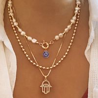 Hip-hop Retro Cross Devil's Eye Palm Gold Plated Artificial Pearls Rhinestones Alloy Wholesale Layered Necklaces sku image 2