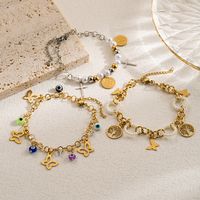 Casual Artistic Cross Devil's Eye Butterfly Stainless Steel Imitation Pearl Layered Gold Plated Bracelets main image 1