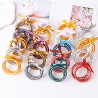 Casual Simple Style Solid Color Bow Knot Plastic Silica Gel Gold Foil Women's Wristband main image 3