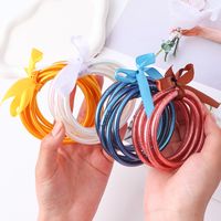 Casual Simple Style Solid Color Bow Knot Plastic Silica Gel Gold Foil Women's Wristband main image 2