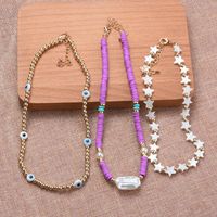 Casual Ethnic Style Star Eye Alloy Soft Clay Beaded Pearl Plating Women's Necklace main image 2