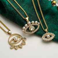 Streetwear Devil's Eye Copper Plating Inlay Artificial Pearls Zircon 18k Gold Plated Pendant Necklace main image 1