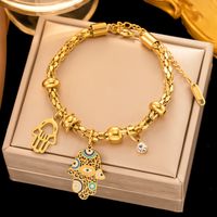 304 Stainless Steel 18K Gold Plated IG Style Ethnic Style Drip Glazed Plating Inlay Devil'S Eye Palm Artificial Rhinestones Bracelets Earrings Necklace main image 3