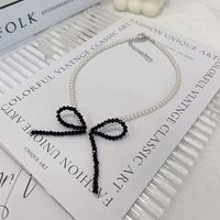 Simple Style Bow Knot Artificial Crystal Artificial Pearl Beaded Women's Pendant Necklace sku image 2