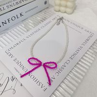 Simple Style Bow Knot Artificial Crystal Artificial Pearl Beaded Women's Pendant Necklace main image 1