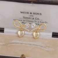 1 Pair Fairy Style French Style Simple Style Heart Shape Bow Knot Plating Inlay Copper Artificial Pearls Zircon 14k Gold Plated Ear Studs main image 2