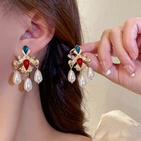 1 Pair Glam Exaggerated Heart Shape Flower Bow Knot Plating Inlay Alloy Artificial Crystal Artificial Rhinestones Artificial Pearls Gold Plated Silver Plated Drop Earrings main image 2
