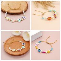 Cute Devil's Eye Smiley Face Flower Arylic Soft Clay Beaded Braid Women's Bracelets main image 1