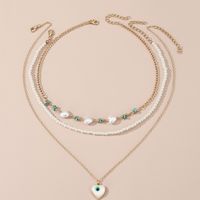 Simple Style Devil's Eye Heart Shape Turquoise Imitation Pearl Alloy Metal Wholesale Necklace main image 1