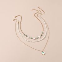Simple Style Devil's Eye Heart Shape Turquoise Imitation Pearl Alloy Metal Wholesale Necklace main image 4