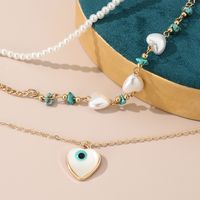 Simple Style Devil's Eye Heart Shape Turquoise Imitation Pearl Alloy Metal Wholesale Necklace main image 3